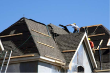 Roofing contractor on a house